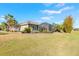 Exterior backyard featuring screened pool and landscaping at 2921 Linari Ct, New Smyrna Beach, FL 32168