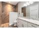 Modern bathroom featuring a walk-in shower with wood-style tile and white vanity with granite countertop at 2921 Linari Ct, New Smyrna Beach, FL 32168