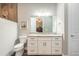 Bright bathroom with granite countertop, white cabinetry and a shower at 2921 Linari Ct, New Smyrna Beach, FL 32168