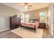 Bedroom featuring a dark wooden bed frame, neutral walls and lots of natural light at 2921 Linari Ct, New Smyrna Beach, FL 32168