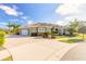 Beautiful single-story home with well-manicured landscaping, three car garage and a paver driveway at 2921 Linari Ct, New Smyrna Beach, FL 32168