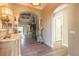 Inviting hallway featuring a decorative table and stylish light fixture, leading into the home's living spaces at 2921 Linari Ct, New Smyrna Beach, FL 32168