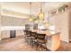 Elegant kitchen with white cabinetry, a large center island, and pendant lighting above at 2921 Linari Ct, New Smyrna Beach, FL 32168