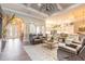 Inviting living room with coffered ceilings, modern finishes, and an open layout for seamless entertaining at 2921 Linari Ct, New Smyrna Beach, FL 32168