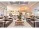 Spacious living room featuring high ceilings, recessed lighting, and an open floor plan to the kitchen and dining area at 2921 Linari Ct, New Smyrna Beach, FL 32168