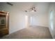 Spacious bedroom featuring neutral carpet, ceiling fan, and natural light from the window at 2995 Ragis Rd, Edgewater, FL 32132