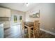 Cozy dining area with modern table set and doors leading to deck at 2995 Ragis Rd, Edgewater, FL 32132