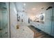 Modern main bathroom featuring dual sinks, vanity, and walk-in shower with marble tile at 2995 Ragis Rd, Edgewater, FL 32132