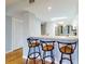 Breakfast bar featuring three barstools and view into the kitchen at 3 Oceans West Boulevard # 3B1, Daytona Beach Shores, FL 32118