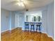 Living room with breakfast bar featuring barstools and view into the kitchen at 3 Oceans West Boulevard # 3B, Daytona Beach Shores, FL 32118