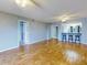 Spacious living room featuring wood flooring, recessed lighting, and a kitchen breakfast bar at 3 Oceans West Boulevard # 3B, Daytona Beach Shores, FL 32118