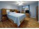 Bedroom with wood floors, paneled furniture, and a window at 3 Oceans West Boulevard # 3B1, Daytona Beach Shores, FL 32118