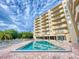 Exterior image of a pool with an apartment building in the background at 3 Oceans West Boulevard # 3B, Daytona Beach Shores, FL 32118