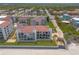 Stunning aerial view of a multi-unit building and the surrounding landscape at 3001 S Atlantic Ave # 204, New Smyrna Beach, FL 32169