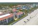 Aerial shot of beachfront condos with pool and beach access at 3001 S Atlantic Ave # 204, New Smyrna Beach, FL 32169