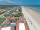 Sweeping aerial view of beachfront villas overlooking the ocean at 3001 S Atlantic Ave # 204, New Smyrna Beach, FL 32169