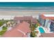 Stunning aerial view of a beachfront villa with pool and ocean access at 3001 S Atlantic Ave # 204, New Smyrna Beach, FL 32169