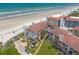 Overhead shot of luxury condo resort on beach front with tile roofs at 3001 S Atlantic Ave # 204, New Smyrna Beach, FL 32169