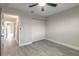 Cozy bedroom with closet and gray wood floors at 3001 S Atlantic Ave # 204, New Smyrna Beach, FL 32169