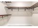 Walk-in closet is equipped with adjustable shelving and closet rod for storage at 3001 S Atlantic Ave # 204, New Smyrna Beach, FL 32169