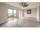 Living room with sliding door to balcony and beach views at 3001 S Atlantic Ave # 204, New Smyrna Beach, FL 32169