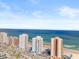 Wide aerial view of beachfront condos, showcasing beach access and blue ocean at 3047 S Atlantic Ave # B050, Daytona Beach, FL 32118