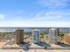 Elevated aerial view of multiple condos on the beach, with intracoastal views at 3047 S Atlantic Ave # B050, Daytona Beach, FL 32118