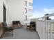 Spacious condo balcony offers views and a comfortable seating area at 3047 S Atlantic Ave # B050, Daytona Beach, FL 32118