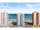 Condo buildings with stunning oceanfront views and private beach access under a blue sky at 3047 S Atlantic Ave # B050, Daytona Beach, FL 32118