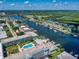 Breathtaking aerial view of the condo complex, a serene waterway, and the lush greenery surrounding the area at 315 N Causeway # 405, New Smyrna Beach, FL 32169