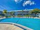 Large community pool with ample seating and clear blue skies at 315 N Causeway # 405, New Smyrna Beach, FL 32169