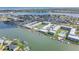 Stunning aerial view of waterfront condos with private boat docks and easy ocean access at 325 N Causeway # B101, New Smyrna Beach, FL 32169