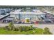 Aerial view of condo complex showing landscaping, parking, and building facade at 325 N Causeway # B101, New Smyrna Beach, FL 32169