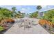 Condo community with outdoor fire pit area surrounded by lush tropical landscaping at 325 N Causeway # B101, New Smyrna Beach, FL 32169