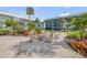 Inviting condo community with a cozy outdoor fire pit and rocking chairs at 325 N Causeway # B101, New Smyrna Beach, FL 32169