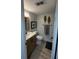 Cozy bathroom with modern fixtures, decorative accents, and wood-look flooring at 325 N Causeway # B101, New Smyrna Beach, FL 32169