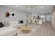 A contemporary living room featuring an open floor plan and easy access to the kitchen at 325 N Causeway # B101, New Smyrna Beach, FL 32169