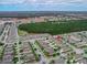 Bird's eye view of neighborhood featuring cozy single-Gathering homes and lush landscapes at 3368 Tuscano Ne Ave, New Smyrna Beach, FL 32168