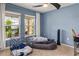 Bedroom featuring two bright windows, a ceiling fan, and plush carpeting at 3368 Tuscano Ne Ave, New Smyrna Beach, FL 32168