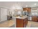 Spacious kitchen featuring a large island, stainless steel appliances, and granite countertops at 3368 Tuscano Ne Ave, New Smyrna Beach, FL 32168