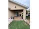 Cozy covered patio with stone flooring, overlooking the yard at 3368 Tuscano Ne Ave, New Smyrna Beach, FL 32168