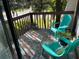 Comfortable balcony featuring chairs, a vibrant rug, and greenery, perfect for relaxing outdoors at 3656 Jackson St # A-2, Port Orange, FL 32129