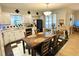 Traditional eat-in kitchen featuring a large, adjacent dining table and decorative black and white tile at 3656 Jackson St # A-2, Port Orange, FL 32129