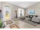 Welcoming foyer with a view into the living area featuring neutral decor and ample natural light at 3783 Sweet Grove Ct, Port Orange, FL 32129