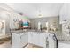 Kitchen area features granite countertops, white cabinets, stainless steel appliances, and access to the living area at 3783 Sweet Grove Ct, Port Orange, FL 32129