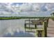 Waterfront views and private boat slips await on the shared community dock at 43 Jacaranda Cay Ct # 430, New Smyrna Beach, FL 32169