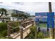 Community dock with informational signage provides waterfront access and boating guidelines at 43 Jacaranda Cay Ct # 430, New Smyrna Beach, FL 32169