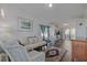 Cozy living room with bright white walls, hardwood floors, and comfortable seating arrangement at 43 Jacaranda Cay Ct # 430, New Smyrna Beach, FL 32169