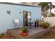 Relaxing patio with outdoor furniture, potted plants, and a sliding glass door at 43 Jacaranda Cay Ct # 430, New Smyrna Beach, FL 32169