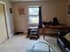 Bright living room with window, tile flooring, and simple decor at 434 Palmetto St, Edgewater, FL 32132